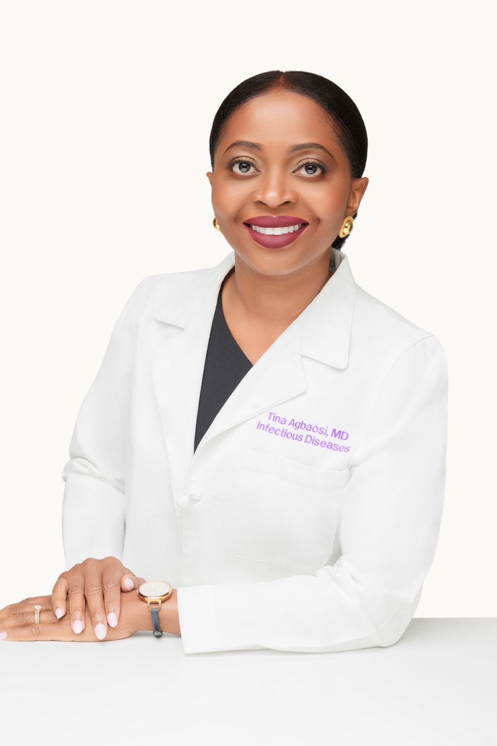 Dr. Tina Agbaosi in a white coat